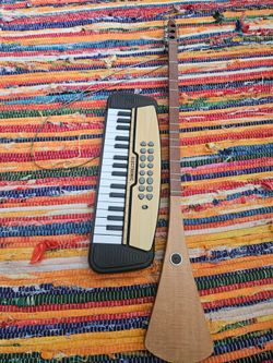 Electronic Toy Keyboard and Hansdmade Folk String Instrument