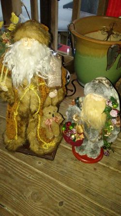 Two stand up Santa statues