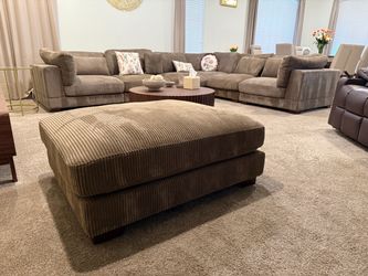 Arliz 7-Piece 144” Wide Reversible Modular Corner Sectional with Ottoman
