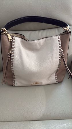 Tan and cream coach purse