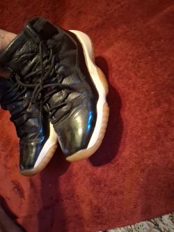 Air Jordan 11 Black Patent Leather Sneakers
