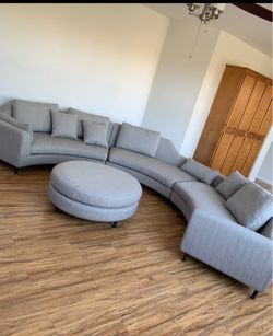Gray Curved Sectional Sofa with Ottoman
