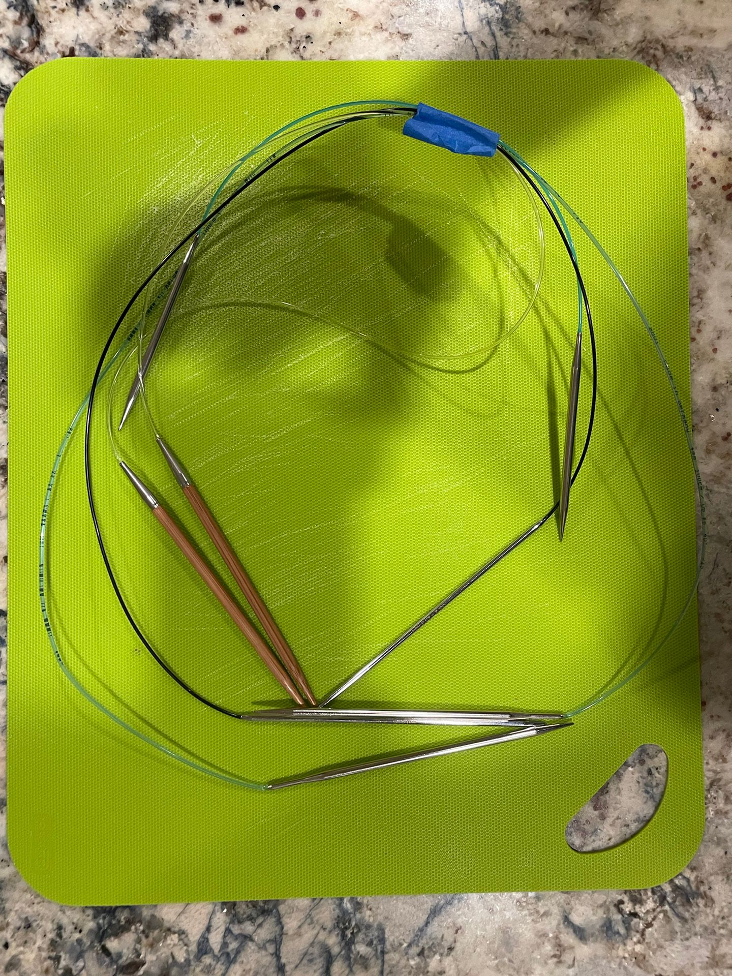 Four Circular Fixed Metal Needles Of Various Lengths And Sizes