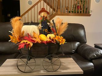 Fall decor, scarecrow in a wagon