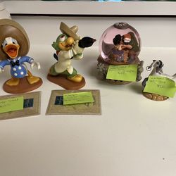 Vintage Disney collectible figurines and snow globes