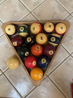 Vintage pool table balls and rack