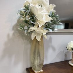 Vase with artificial flowers..