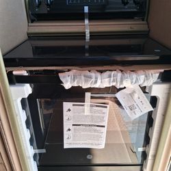 GE - 5.3 Cu. Ft. Freestanding Electric Range with Steam Cleaning and 4 Burner Radiant Cookto