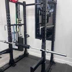 Like new Squat Rack with Dip bars, Pull Up bar, Land mine attachment, Olympic barbell, & Safety bars 