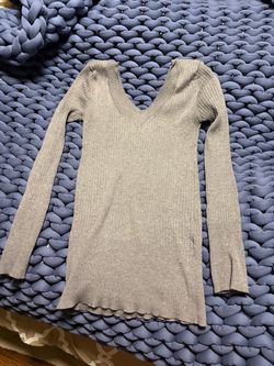 Ribbed knit long sleeve top with a deep V-neck