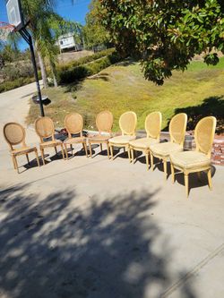 8 vintage cane back chairs