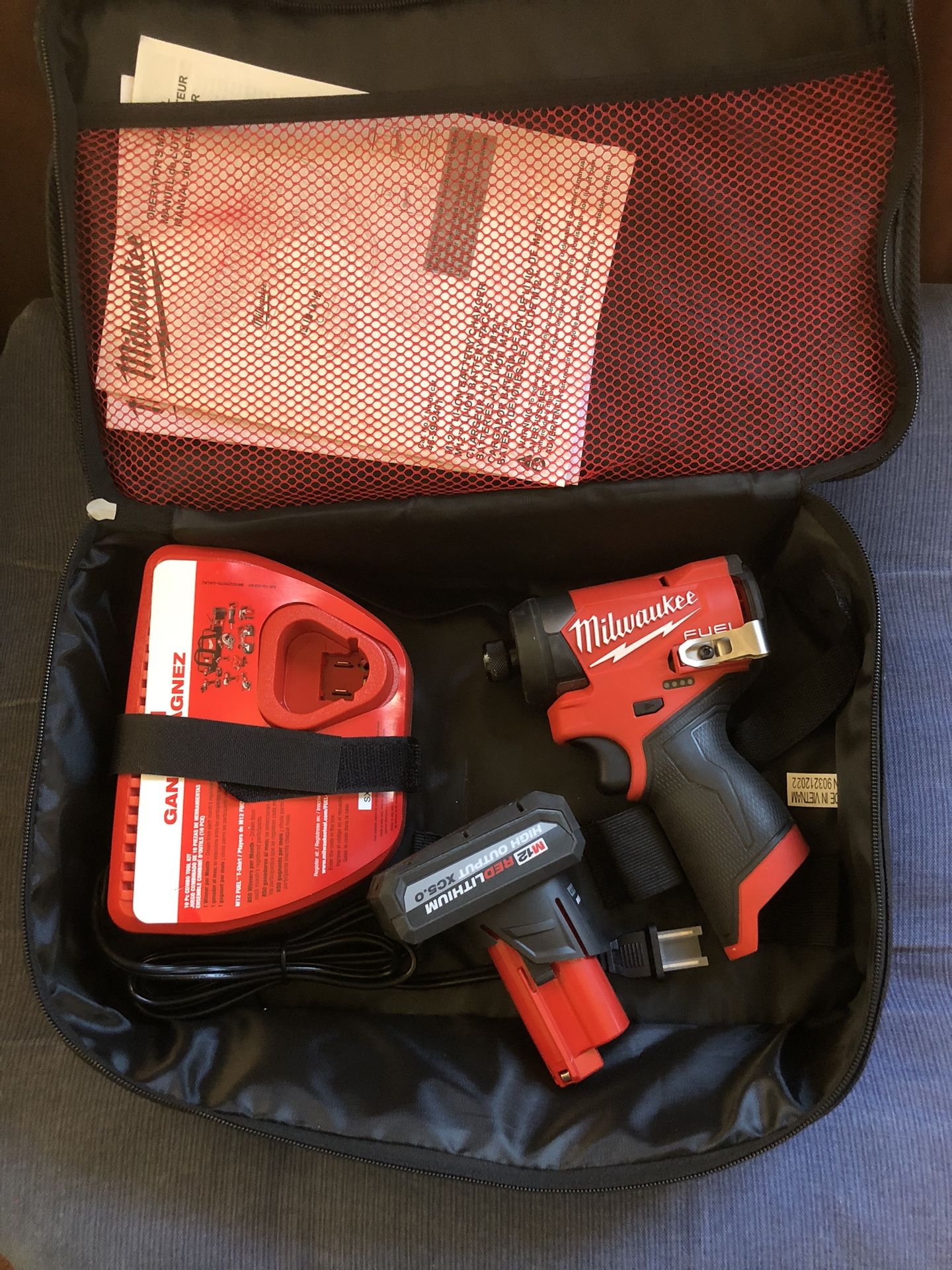 Milwaukee M12 FUEL 12V Lithium-Ion Brushless Cordless 1/4 in. Hex Impact Driver with M12 XC High Output 5.0 Ah Battery