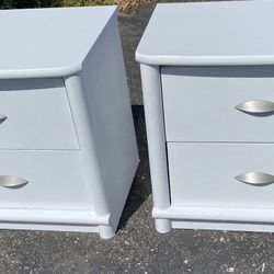 Nightstands, one pair white Yes, two nightstands two drawers each which slides really really well and has satin silver handles.  Number 0610 and numbe