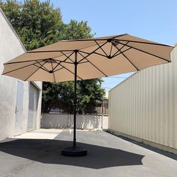 $130 (New in Box) Large 15 ft double sided outdoor umbrella with 65 lbs plastic weight base (beige color) 