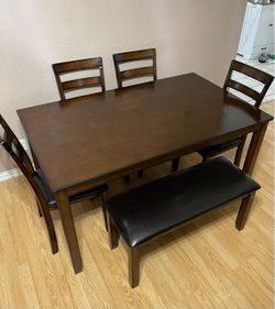 6-PC DARK BROWN FINISH DINING SET (1 DINING TABLE, 1 PADDED BENCH AND 4 PADDED CHAIRS)