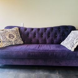 Gorgeous Purple Velvet Sofa With Decorative Pillows