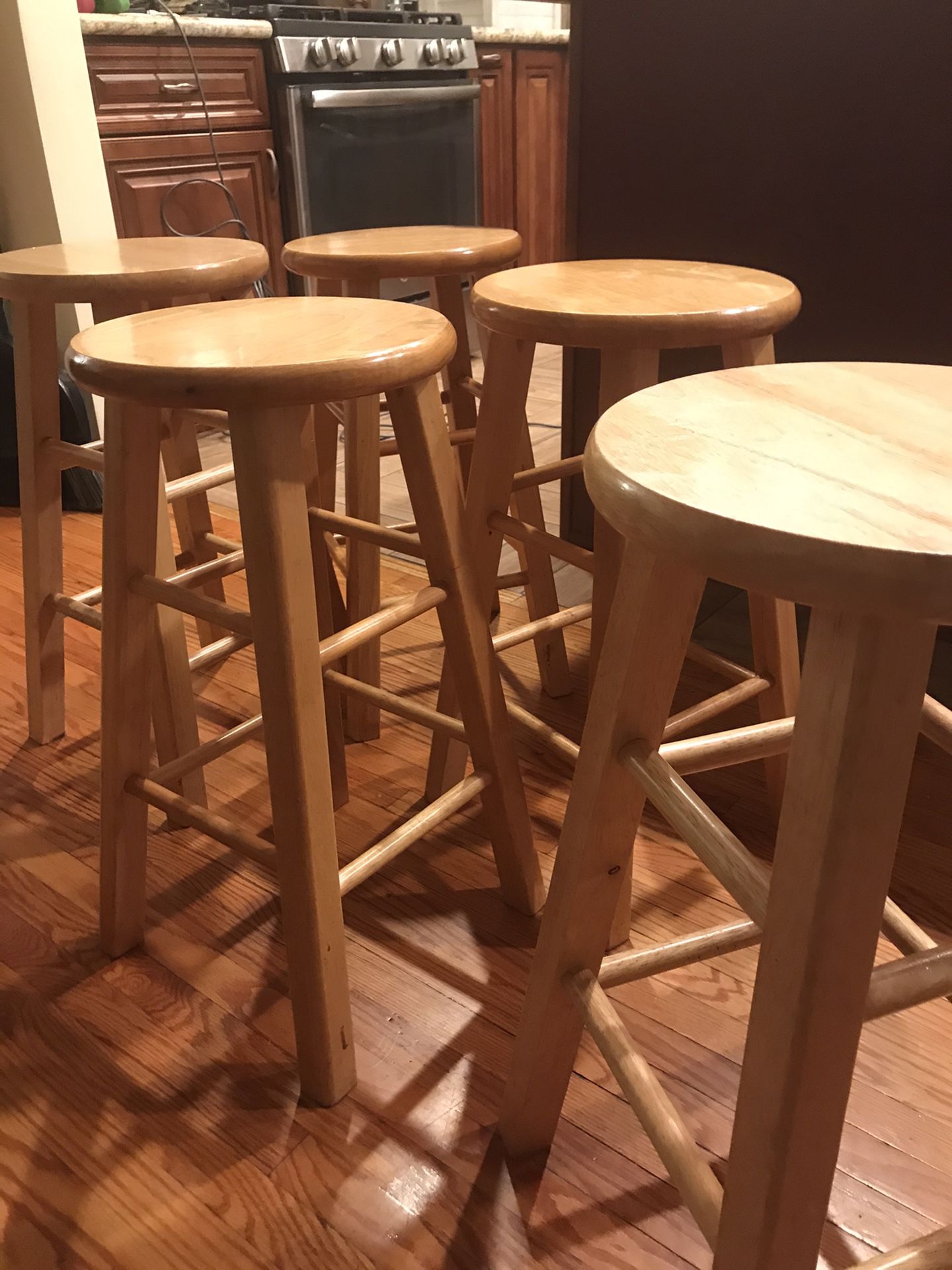 Five used wooden bar stools