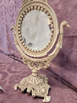 Vintage ornate cast iron vanity mirror