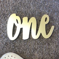 gold “ONE” sign