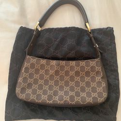 Authentic brown Gucci bag with dust cover 13 .5 “ By 9.5”