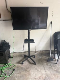 42 inch tv w/rolling stand