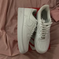 All white Nikes, size 8.5 in men