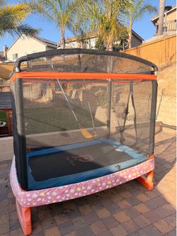 Well loved trampoline with swing.