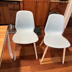 2 blue plastic chairs