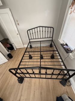 Full size metal bedframe with risers (they have charging plugs)