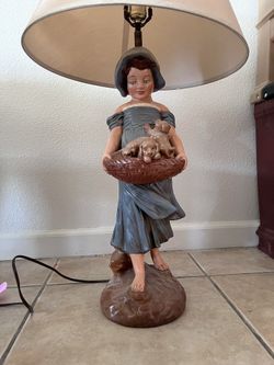 Vintage rehandpainted lamp of girl holding puppies