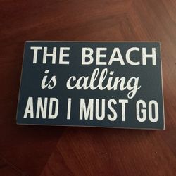 "The Beach is Calling and I Must Go" sign

