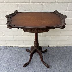 Antique mahogany side or tea table with claw feet