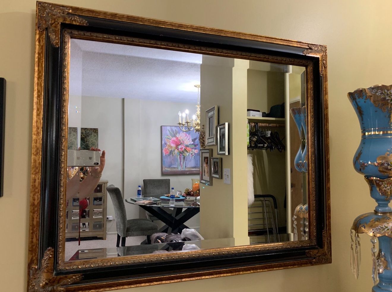 Mirror with black and gold trim