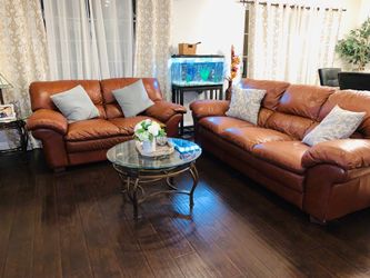 0Leather couches and 2 tables
