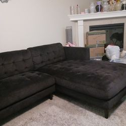 BLACK SECTIONAL ITS SCOTCHGUARED SO EASY TO GET SPOTS OFF..THERE ARE A FEW BUT CANT SEE