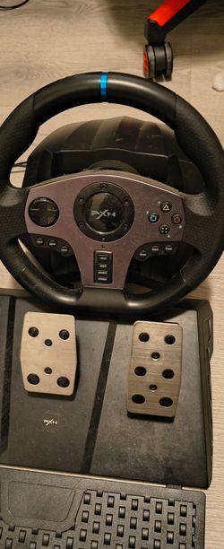 Pxn steering wheel with pedals and cords with the switch gears. Works great