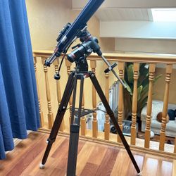 Meade Model 295 telescope, which is a refracting telescope