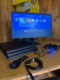 Sony PlayStation 4 Pro Console with Controller and Cables