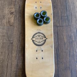 Julian Davidson Skateboard With Four Green Wheels