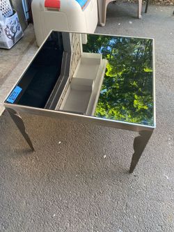 One stainless frame tinted glass side table