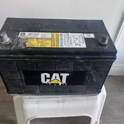 This is a Caterpillar (Cat) heavy-duty battery, Premium High-Output (PHO) or Heavy Duty (HD) model.