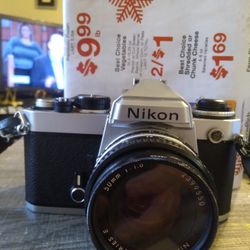 VINTAGE NIKON FE,,WITH NIKON LENS SERIES E,SKYLIGHT FILTER..