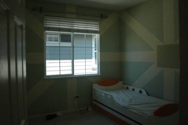 Two twin size beds (made in Germany) with mattresses and slide out drawers