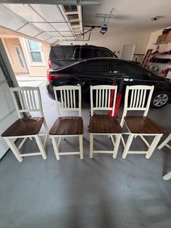 Cream slat-back dining chairs with dark wood seats — set of 4.