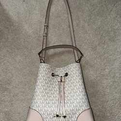 Pink, white, and gold Michael Kors purse