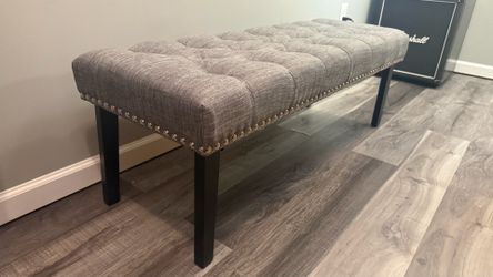 Grey upholstered bench