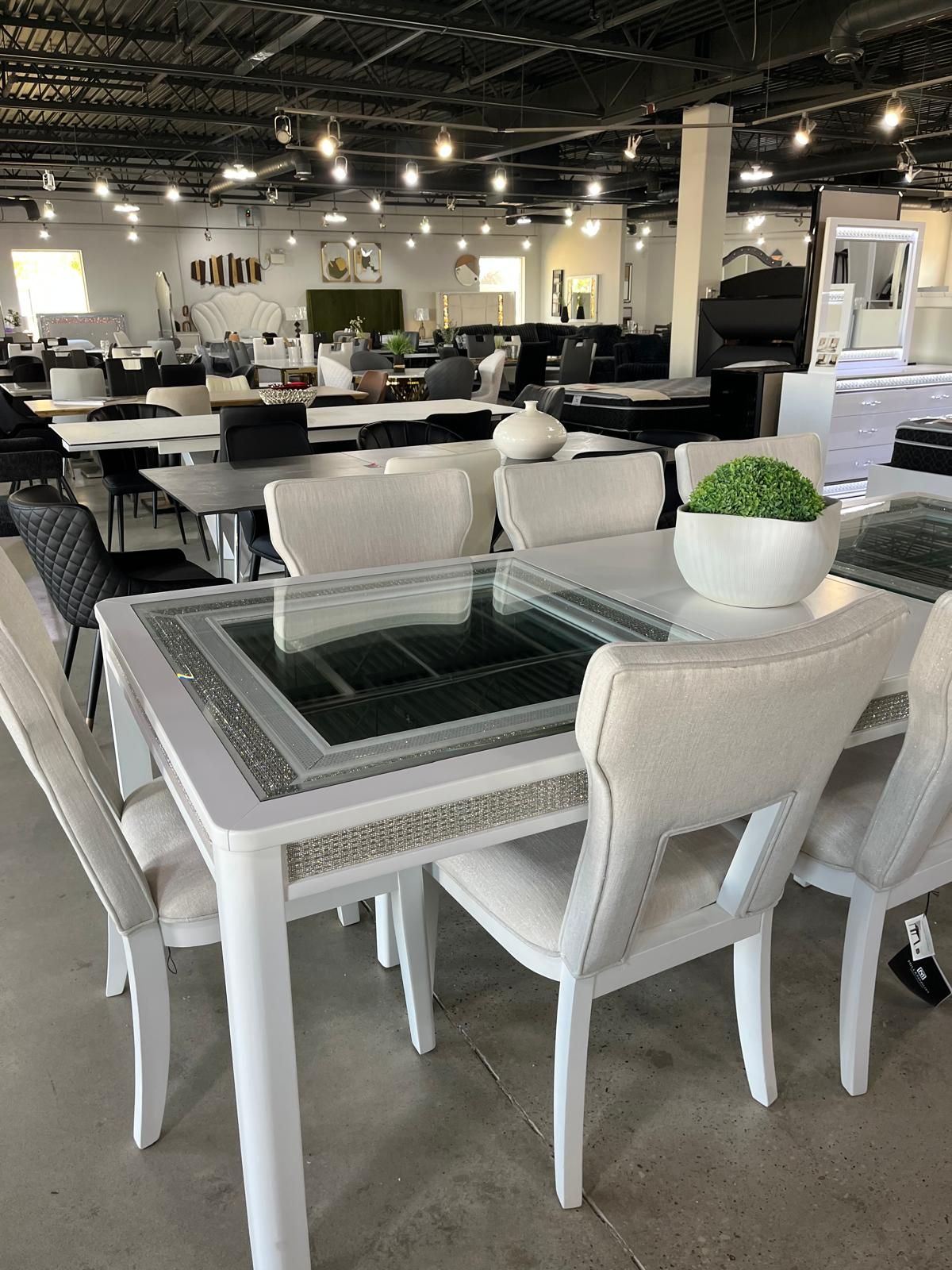 Large Dining Set features contemporary rhinestone frame in bright White lacquer
