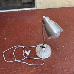 LimeLights Flossy Organizer Desk Lamp with a flexible gooseneck and a charging outlet.