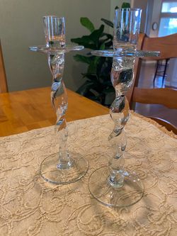 Clear glass vintage twisted taper candle holders. 10 inch tall x 3 inch base. Good condition.