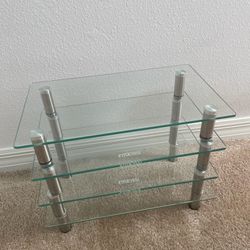  4 x Glass Monitor Stands with height adjustable ~ 15”L x 10”W X 3”H per stand   Price listed includes for all four stands 